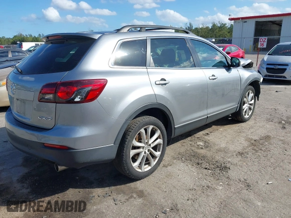 2015 Mazda CX-9 Sport with VIN JM3TB2BA1F0467162, listed as a IAAI auction lot 41565602 with 127,957 mi miles and . Bid and sale history available at carsss.com. Image 4.
