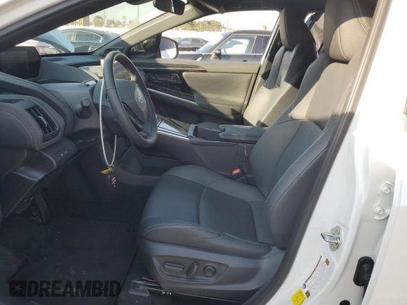 2024 Toyota bZ4X XLE with VIN JTMABACA6RA065029, listed as a Copart auction lot 43008655 with 15,489 mi miles and Salvage Title. Bid and sale history available at DreamBid. Image 7.