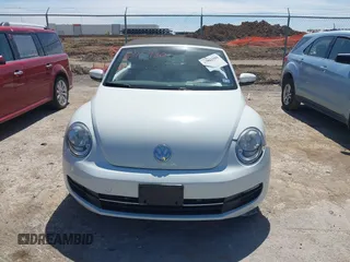 2015 Volkswagen Beetle 1.8T w/Tech with VIN 3VW517AT9FM810122, listed as a IAAI auction lot 41815980 with 72,420 mi miles and . Bid and sale history available at DreamBid. Image 12.