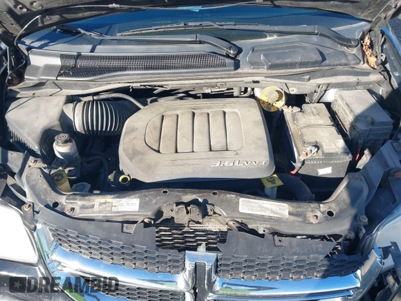 2014 Dodge Grand Caravan SXT with VIN 2C4RDGCG4ER337202, listed as a IAAI auction lot 40781755 with 258,524 mi miles and . Bid and sale history available at DreamBid. Image 10.