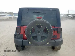 2013 Jeep Wrangler Unlimited Sport z VIN 1C4BJWDGXDL606491, wystawiony jako Copart lot #56065425 z przebiegiem 168 709 mil mil oraz Szkoda całkowita • Salvage title. Historia ofert i sprzedaży dostępna na DreamBid. Obrazek 6.