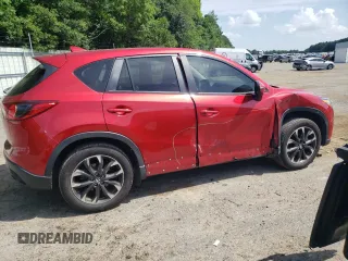 2016 Mazda CX-5 Grand Touring z VIN JM3KE2DY0G0722334, wystawiony jako Copart lot #59998185 z przebiegiem 51 449 mil mil oraz Szkoda całkowita • Salvage title. Historia ofert i sprzedaży dostępna na DreamBid. Obrazek 3.