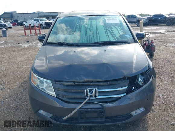 2011 Honda Odyssey Touring with VIN 5FNRL5H93BB104436, listed as a IAAI auction lot 40426003 with 93,342 mi miles and . Bid and sale history available at DreamBid. Image 12.
