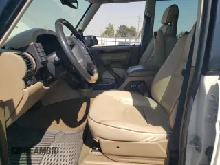 2002 Land Rover Discovery Cloth z VIN SALTY15492A765236, wystawiony jako Copart lot #68991324 z przebiegiem Nie podano mil oraz Szkoda całkowita • Salvage title. Historia ofert i sprzedaży dostępna na DreamBid. Obrazek 7.