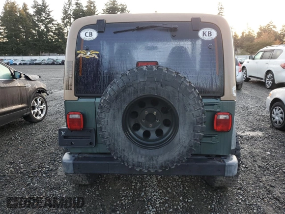2000 Jeep Wrangler Sport with VIN 1J4FA49S1YP748529, listed as a Copart auction lot 77041924 with 154,949 mi miles and Salvage Title. Bid and sale history available at carsss.com. Image 6.