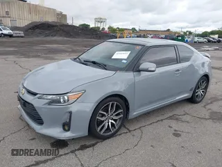2014 Scion tC z VIN JTKJF5C71E3081033, wystawiony jako IAAI lot #42333111 z przebiegiem 144 124 mil mil oraz . Historia ofert i sprzedaży dostępna na DreamBid. Obrazek 2.