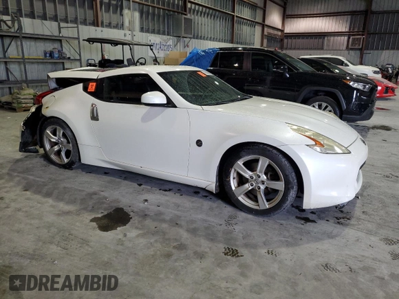2012 Nissan 370Z z VIN JN1AZ4EH3CM565276, wystawiony jako Copart lot #56654845 z przebiegiem 77 788 mil mil oraz Nie do naprawy. Historia ofert i sprzedaży dostępna na DreamBid. Obrazek 4.