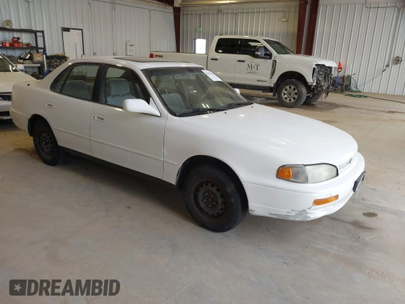 1996 Toyota Camry DX with VIN JT2BG12K3T0401659, listed as a IAAI auction lot 41874795 with 169,406 mi miles. Bid and sale history available at carsss.com. Image 1.