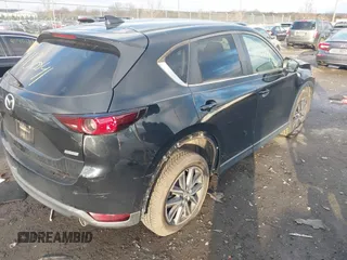 2018 Mazda CX-5 Touring z VIN JM3KFACM3J1435089, wystawiony jako IAAI lot #41130041 z przebiegiem 80 446 mil mil oraz . Historia ofert i sprzedaży dostępna na DreamBid. Obrazek 4.