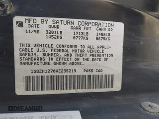 1997 Saturn SC z VIN 1G8ZH1270VZ235219, wystawiony jako IAAI lot #42229262 z przebiegiem 107 874 mil mil oraz . Historia ofert i sprzedaży dostępna na DreamBid. Obrazek 9.