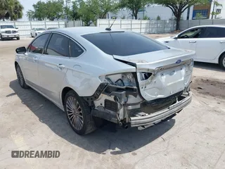 2014 Ford Fusion Titanium with VIN 3FA6P0K99ER358244, listed as a IAAI auction lot 42085703 with 194,626 mi miles. Bid and sale history available at carsss.com. Image 3.