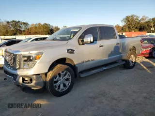 2016 Nissan Titan S with VIN 1N6AA1F43GN512816, listed as a Copart auction lot 82817474 with 71,257 mi miles and Salvage title. Bid and sale history available at DreamBid. Image 1.