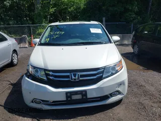 2014 Honda Odyssey Touring with VIN 5FNRL5H94EB071788, listed as a IAAI auction lot 42523959 with 244,734 mi miles and . Bid and sale history available at DreamBid. Image 12.