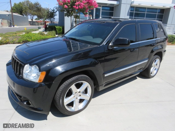 2007 Jeep Grand Cherokee SRT-8 with VIN 1J8HR78347C515195, listed as a Copart auction lot 77478044 with 126,330 mi miles and Salvage Title. Bid and sale history available at carsss.com. Image 2.