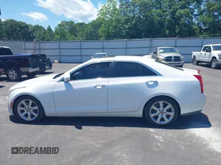 2016 Cadillac ATS Luxury Collection RWD z VIN 1G6AB5RX4G0133529, wystawiony jako IAAI lot #42314146 z przebiegiem 158 897 mil mil oraz . Historia ofert i sprzedaży dostępna na DreamBid. Obrazek 14.