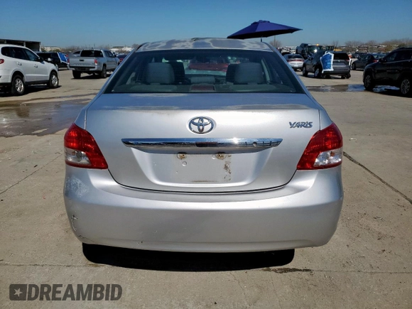 2012 Toyota Yaris with VIN JTDBT4K33C1416217, listed as a Copart auction lot 46714115 with 212,894 mi miles and Salvage Title. Bid and sale history available at DreamBid. Image 6.