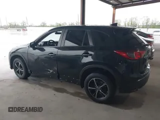2016 Mazda CX-5 Touring with VIN JM3KE2CY2G0808424, listed as a IAAI auction lot 41880494 with 149,005 mi miles. Bid and sale history available at carsss.com. Image 14.