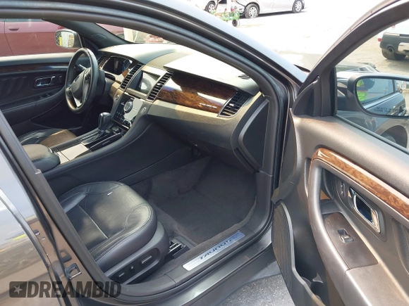 2018 Ford Taurus Limited z VIN 1FAHP2F8XJG129966, wystawiony jako IAAI lot #42319661 z przebiegiem 112 937 mil mil oraz . Historia ofert i sprzedaży dostępna na DreamBid. Obrazek 5.