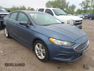 2018 Ford Fusion SE z VIN 3FA6P0H74JR226458, wystawiony jako IAAI lot #42369099 z przebiegiem 187 678 mil mil oraz . Historia ofert i sprzedaży dostępna na DreamBid. Obrazek 1.