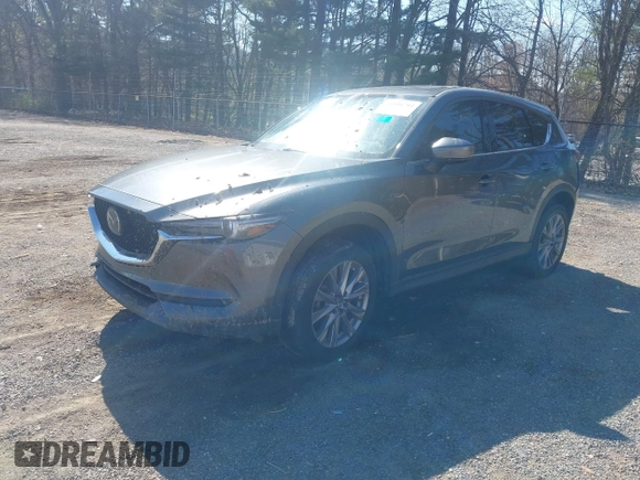 2020 Mazda CX-5 Grand Touring with VIN JM3KFBDM1L0821975, listed as a IAAI auction lot 40088794 with 68,895 mi miles and . Bid and sale history available at DreamBid. Image 23.