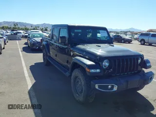 2022 Jeep Gladiator Texas Trail with VIN 1C6HJTAG7NL128584, listed as a IAAI auction lot 40630493 with Not Provided miles and . Bid and sale history available at DreamBid. Image 1.