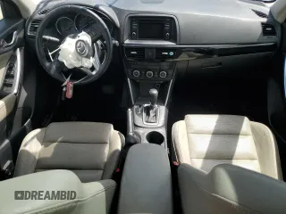 2015 Mazda CX-5 Grand Touring with VIN JM3KE4DY0F0458719, listed as a Copart auction lot 52960365 with 128,372 mi miles and Salvage Title. Bid and sale history available at DreamBid. Image 8.