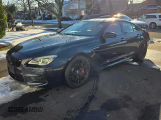 2016 BMW M6 z VIN WBS6E9C57GG437138, wystawiony jako Copart lot #45290525 z przebiegiem 58 645 mil mil oraz Tytuł czysty. Historia ofert i sprzedaży dostępna na DreamBid. Obrazek 2.