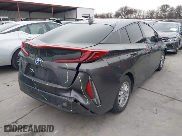 2018 Toyota Prius Plus with VIN JTDKARFPXJ3087064, listed as a IAAI auction lot 41433495 with 118,298 mi miles and . Bid and sale history available at DreamBid. Image 4.