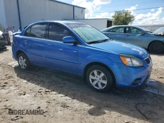2010 Kia Rio LX with VIN KNADH4A33A6632951, listed as a Copart auction lot 72629144 with 168,289 mi miles and Salvage Title. Bid and sale history available at DreamBid. Image 4.