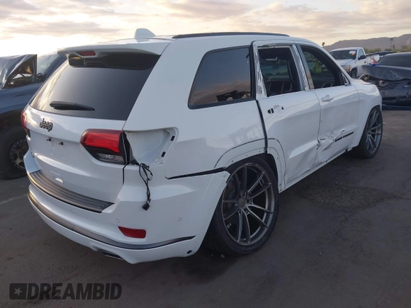 2018 Jeep Grand Cherokee Overland z VIN 1C4RJFCG7JC158464, wystawiony jako IAAI lot #42056386 z przebiegiem 94 608 mil mil oraz . Historia ofert i sprzedaży dostępna na DreamBid. Obrazek 4.