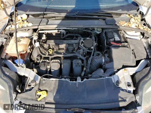 2014 Ford Focus Titanium z VIN 1FADP3N2XEL263357, wystawiony jako Copart lot #84610634 z przebiegiem 142 023 mil mil oraz Nie do naprawy • Non repairable. Historia ofert i sprzedaży dostępna na DreamBid. Obrazek 13.