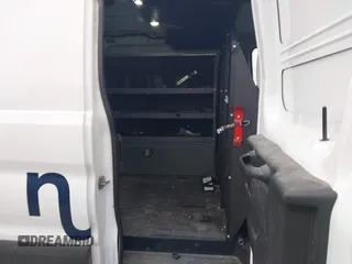 2019 Ford Transit with VIN 1FTYE1ZM2KKB46391, listed as a IAAI auction lot 41362328 with 128,327 mi miles and . Bid and sale history available at carsss.com. Image 8.