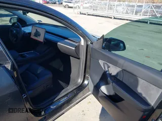 2022 Tesla Model Y Long Range with VIN 7SAYGDEEXNF424856, listed as a IAAI auction lot 41059718 with 44,439 mi miles and . Bid and sale history available at carsss.com. Image 5.