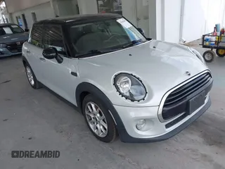 2019 MINI Hardtop 4 Door Cooper z VIN WMWXU1C59K2J02305, wystawiony jako IAAI lot #42205461 z przebiegiem 75 101 mil mil oraz . Historia ofert i sprzedaży dostępna na DreamBid. Obrazek 1.