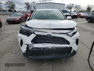 2023 Toyota RAV4 Hybrid LE with VIN JTMMWRFV3PD570648, listed as a Copart auction lot 86983174 with 27,258 mi miles and Salvage title. Bid and sale history available at DreamBid. Image 5.