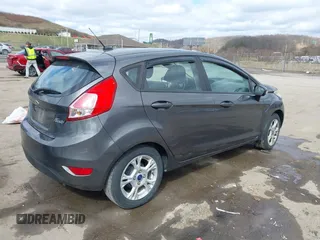 2015 Ford Fiesta SE with VIN 3FADP4EJ0FM117739, listed as a IAAI auction lot 41795558 with 111,000 mi miles. Bid and sale history available at carsss.com. Image 4.