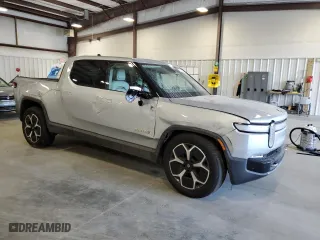 2022 Rivian R1T Adventure Package with VIN 7FCTGAAA4NN014462, listed as a Copart auction lot 73310644 with 89 mi miles and Salvage Title. Bid and sale history available at carsss.com. Image 4.