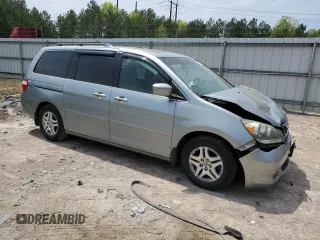 2007 Honda Odyssey EX-L with VIN 5FNRL38657B059033, listed as a Copart auction lot 54005495 with 212,674 mi miles and Salvage Title. Bid and sale history available at DreamBid. Image 4.