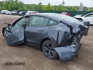 2023 Tesla Model 3 with VIN 5YJ3E1EA9PF673399, listed as a IAAI auction lot 42392643 with 7,571 mi miles and . Bid and sale history available at DreamBid. Image 3.