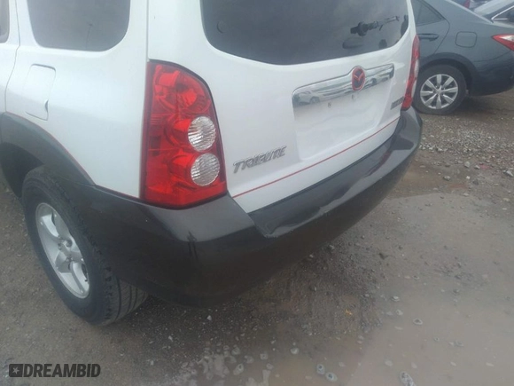 2006 Mazda Tribute i with VIN 4F2YZ02Z06KM26613, listed as a IAAI auction lot 41847931 with 145,164 mi miles. Bid and sale history available at carsss.com. Image 6.