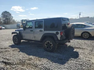 2015 Jeep Wrangler Unlimited Rubicon Hard Rock with VIN 1C4HJWFG2FL686556, listed as a Copart auction lot 54049955 with 126,675 mi miles and Salvage title. Bid and sale history available at DreamBid. Image 2.