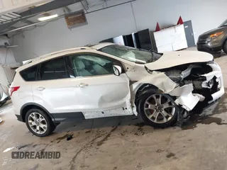 2016 Ford Escape Titanium with VIN 1FMCU9J90GUA18743, listed as a IAAI auction lot 42419730 with 102,666 mi miles and . Bid and sale history available at DreamBid. Image 14.