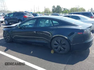 2022 Tesla Model S z VIN 5YJSA1E56NF490064, wystawiony jako IAAI lot #41858477 z przebiegiem Nie podano mil oraz . Historia ofert i sprzedaży dostępna na DreamBid. Obrazek 14.