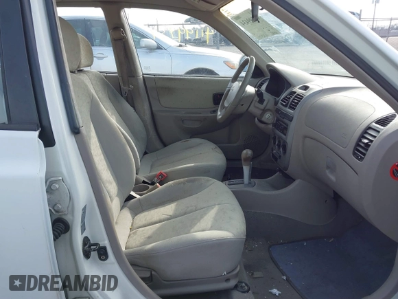2004 Hyundai Accent GL with VIN KMHCG45C64U539526, listed as a IAAI auction lot 41199434 with 81,442 mi miles. Bid and sale history available at carsss.com. Image 5.