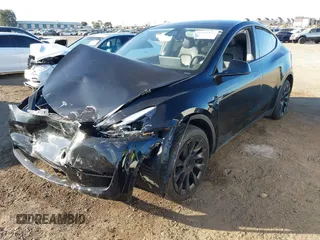 2023 Tesla Model Y Long Range with VIN 7SAYGDEE0PF907260, listed as a IAAI auction lot 41180227 with Not Provided miles and . Bid and sale history available at DreamBid. Image 2.