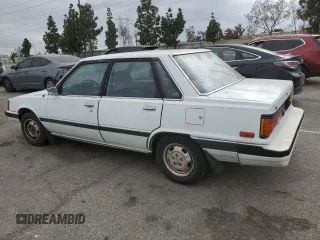1984 Toyota Camry z VIN JT2SV16E3E0220882, wystawiony jako Copart lot #53514345 z przebiegiem 112 430 mil mil oraz Czysty tytuł • Clean title. Historia ofert i sprzedaży dostępna na DreamBid. Obrazek 2.