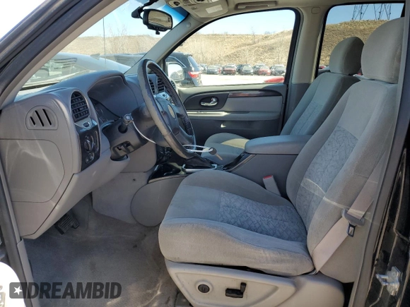 2005 GMC Envoy SLE z VIN 1GKDT13S752390266, wystawiony jako Copart lot #50766935 z przebiegiem 115 225 mil mil oraz Szkoda całkowita • Salvage title. Historia ofert i sprzedaży dostępna na DreamBid. Obrazek 7.
