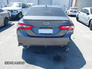 2019 Toyota Camry LE z VIN 4T1B11HK5KU166295, wystawiony jako IAAI lot #42087581 z przebiegiem 87 876 mil mil oraz . Historia ofert i sprzedaży dostępna na DreamBid. Obrazek 6.