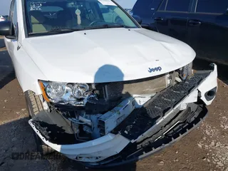 2011 Jeep Compass with VIN 1J4NT1FA2BD239588, listed as a IAAI auction lot 41324431 with 190,116 mi miles. Bid and sale history available at carsss.com. Image 6.