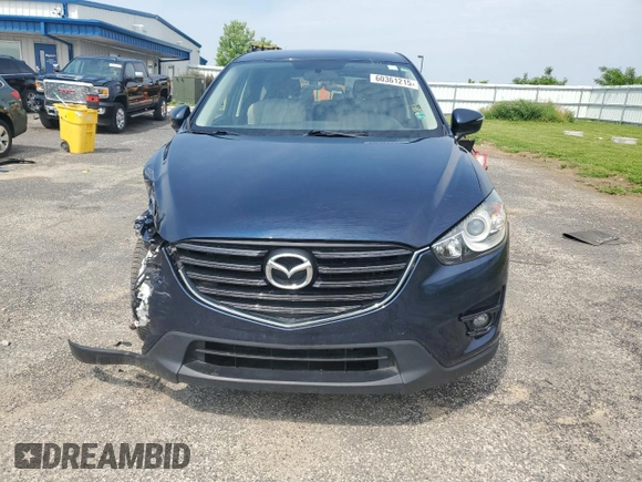 2016 Mazda CX-5 Touring с VIN JM3KE4CY8G0686101, выставлен на аукционе Copart как лот 60361215 с пробегом 126 804 миль миль и На запчасти • Non repairable. История ставок и продаж доступна на DreamBid. Изображение 5.